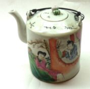 An Oriental Cylindrical Teapot with lopped wirework handle, and the body painted in colours with