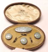 A cased white metal and blue enamel Dress Set of Brooch (pin detached) and three Buttons, the case