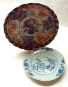 An 18th Century Chinese Plate of circular form, typically decorated in underglaze blue (hairline