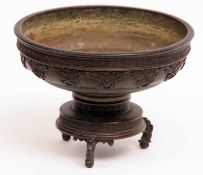 An Oriental Bronze Incense Bowl with pull-off stand, of spreading circular form and embossed with