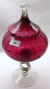A large Cranberry and Clear Glass Covered Vase, raised on a split rope-twist design stem and a round
