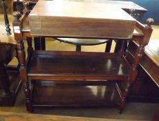 A Victorian Mahogany Three Tier Buffet Cabinet, with turned side supports, raised on castors, 38”