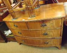 A 19th Century Mahogany Bow Front Chest of two short and two long drawers, with oval brass plate