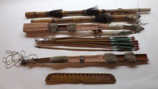 A 20th Century Amazonian Blow Pipe; a similar Bow; twelve metal-tipped Arrows and an Arrow Holder,