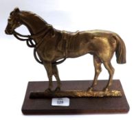 A 20th Century Brass Doorstop modelled as a horse on a rectangular iron base, 9 ½” long