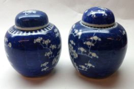 Two Oriental Ginger Jars, each decorated in underglaze blue with a prunus blossom design, one with 6