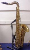 A 1920s Art Deco Gold Lacquered Tenor Saxophone with stencilled barrel