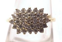 A yellow metal indistinctly marked Diamond Cluster Ring