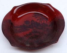 A small Royal Doulton Flambé shaped oval Dish, decorated with a rural scene with church, 6” wide