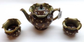 A Doulton Lambeth Stoneware Teapot, with flared lip, decorated with raised design of sea-shells,
