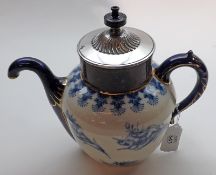 A Royales Patent Self-Pouring Teapot, manufactured by Doulton and typically decorated in blue with