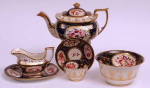 A 19th Century John Rose, Coalport part Tea Service, decorated with floral sprays on a blue and gilt