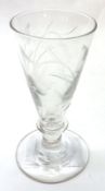 A decorative small conical Wine Glass etched with a flowing foliate motif on a single knopped stem
