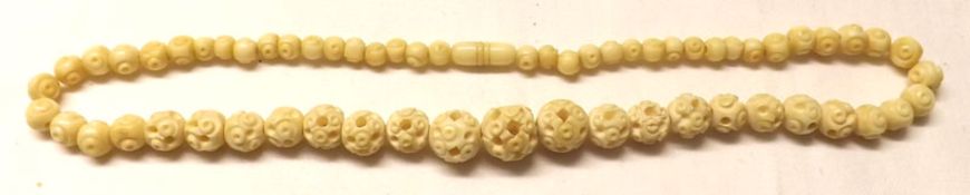 An early 20th Century Carved and Pierced Bone Bead Necklace
