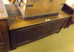 An 18th Century Oak Plank Top Coffer with three panelled front, initialled RD, 48” wide