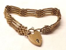 An early 20th Century 9ct Gold Four Bar Gate Bracelet with engraved and plain links, weighing
