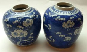 Two Oriental Ginger Jars, decorated in underglaze blue with prunus blossom designs, each with 4