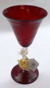 A 20th Century Ruby Clear and Gilt Glass Goblet, the stem modelled as a dolphin, marked to base “