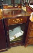 A late Victorian Mahogany Side or Music Cabinet, with lifting lid, single bevelled glazed door,