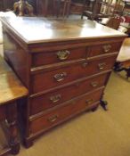 An early 19th Century Oak and Crossbanded Chest of two short and three full length drawers with