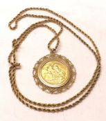 An Elizabeth II Gold Sovereign dated 1963, within a Filigree hallmarked 9ct Gold Pendant Mount and