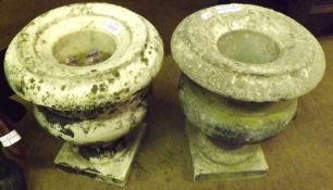 A pair of small Marble Urns of typical form, on square plinth bases, 9 ½” wide