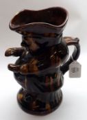 A large Victorian Treacle Glazed Toby Jug of typical form, 9 ½” high