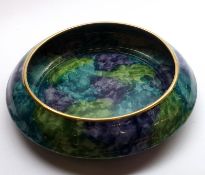 A Hancock & Sons Corona Ware Shallow Fruit Dish decorated in greens, blues and purples, 11” wide