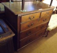 An 18th Century Oak Chest of two short and three long drawers with later swan neck handles, raised