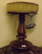 An early Victorian Rosewood Adjustable Piano Stool with round tapestry upholstered top, on a