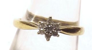 A hallmarked 9ct Gold five small Brilliant Cut Diamond Ring of flower head design, approximately .