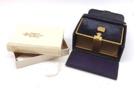 A Brass and plush-bound Miniature Church Services Book, with original travelling case; together with