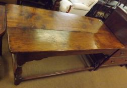 A 19th Century Oak and Elm small Refectory type Dining Table, raised on turned legs with stretcher