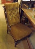 A Victorian Mahogany Framed Nursing Chair, upholstered in brown fabric with buttoned back, 22” wide