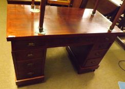 A Victorian Twin Pedestal Desk with unusual red lacquered finish, 47” wide