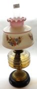 A late 19th Century Oil lamp with clear glass chimney, opaque floral decorated glass shade, clear