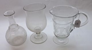 A Clear Glass Lemonade Jug with a cut glass design of vines; together with a Clear Glass Goblet