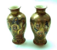 A pair of Satsuma Baluster Vases, brightly decorated in typical colours with immortals, (one with