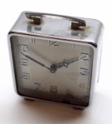 A Vintage Chromium Cased Bedside Alarm Clock, the back marked “DRPA”, 2 ½” wide