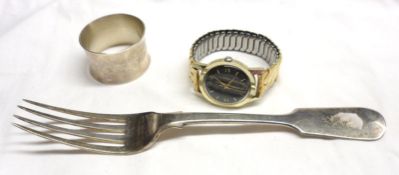 A Mixed Lot comprising: a Victorian Fiddle pattern Table Fork; a modern round Napkin Ring of plain