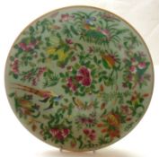 A Chinese Celadon Circular Plate, typically painted in famille rose etc with exotic birds,