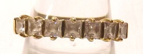 A high grade precious metal seven Princess Cut White Stone Ring, stamped “.750”