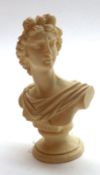 A Carved Ivorine Bust of Apollo, 4 ¼” high