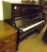 A late 19th/early 20th Century Upright Ebonised Cased Overstrung Piano, F Adam of Krefeld, 55” wide