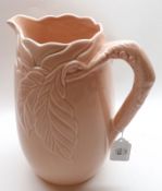 A Clarice Cliff Newport Pottery Pink Glazed Jug, (pouring lip A/F), 9 ½” high