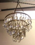 A 20th Century Four Tier Hanging Centre Ceiling Light Shade with clear prismatic glass drops