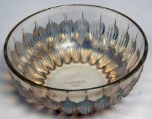 An R Lalique France circular Bowl, moulded and decorated with an opalescent stylised foliate design,