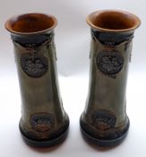 A pair of Royal Doulton Stoneware Vases of round tapering form, decorated with raised floral