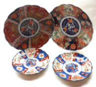 A pair of Imari Circular Plates with scalloped rims, typically decorated in traditional colours with