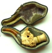 A cased Meerschaum Pipe, the bowl carved with deer’s head (lacking antlers), white metal collar,